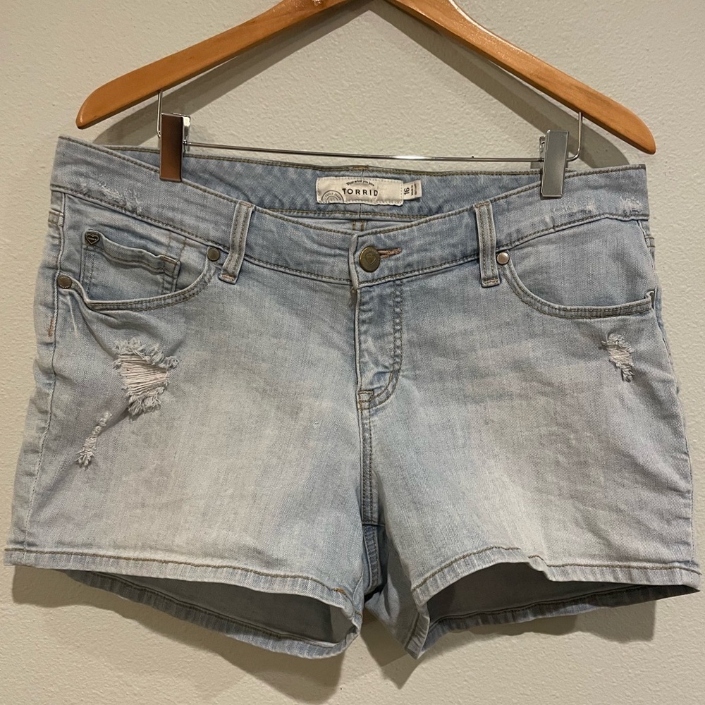 Torrid light wash manufactured distressed Jean shorts. Size 16